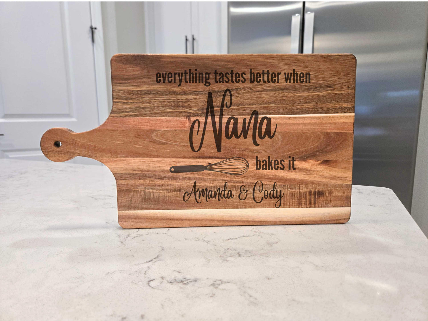 Everything Tastes Better When Nana Bakes it Handle Cutting Board